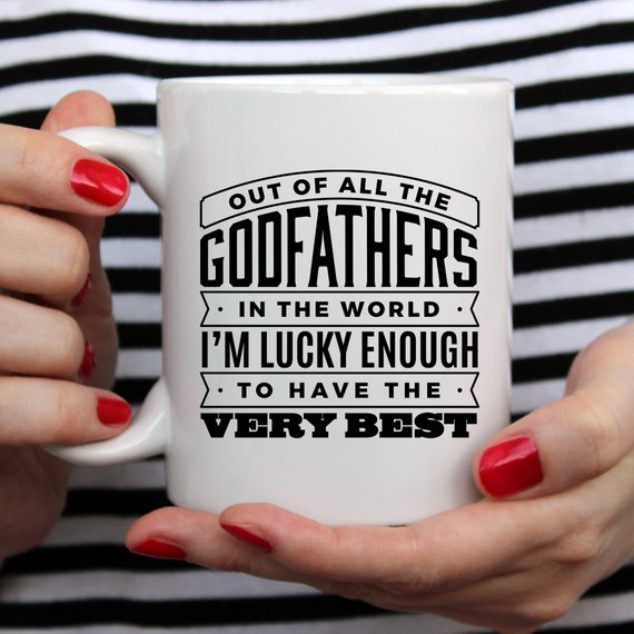 Funny coffee mug featuring 'Out Of All The Godfathers In The World' design, crafted from high-quality ceramic.