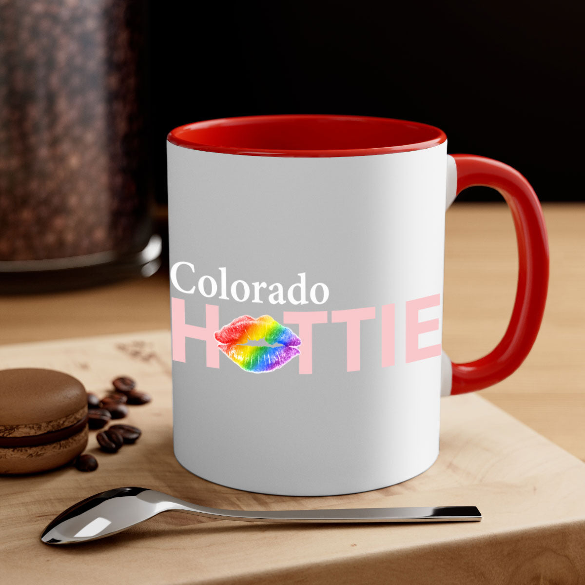 Colorful Colorado Hottie Mug featuring rainbow lips design with a glossy finish and C-shaped handle.