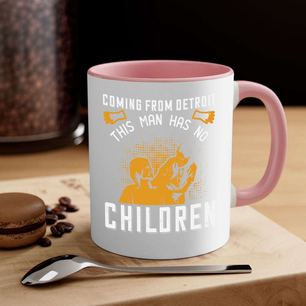 Two-tone ceramic mug with colored handle and interior, featuring the phrase 'Coming from Detroit this man has no children' in a glossy finish.