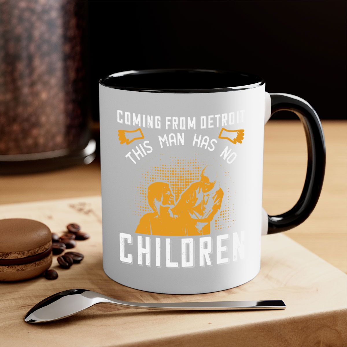 Two-tone ceramic mug with colored handle and interior, featuring the phrase 'Coming from Detroit this man has no children' in a glossy finish.