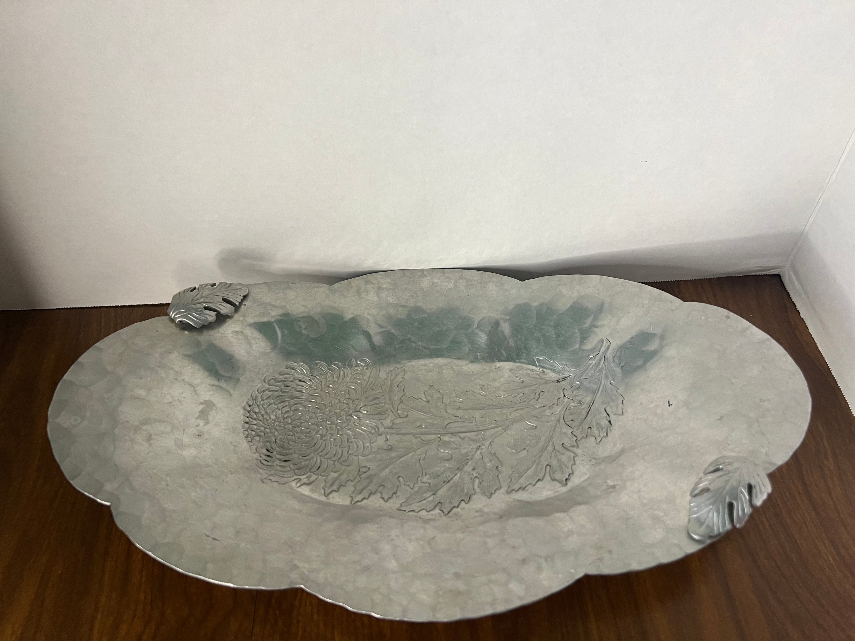 Vintage Continental Hall Mark hand-wrought aluminum tray featuring an intricate chrysanthemum design, showcasing exquisite craftsmanship from the 1950s.
