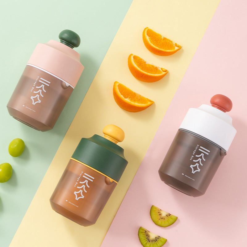 Creative Manual Juicer Portable Blender in white, green, and pink colors, showcasing its compact and stylish design.