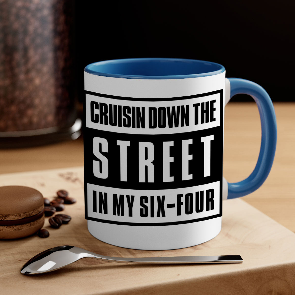 A stylish black and colored two-tone ceramic mug with glossy finish, featuring the phrase 'cruisin down the street 181#'.