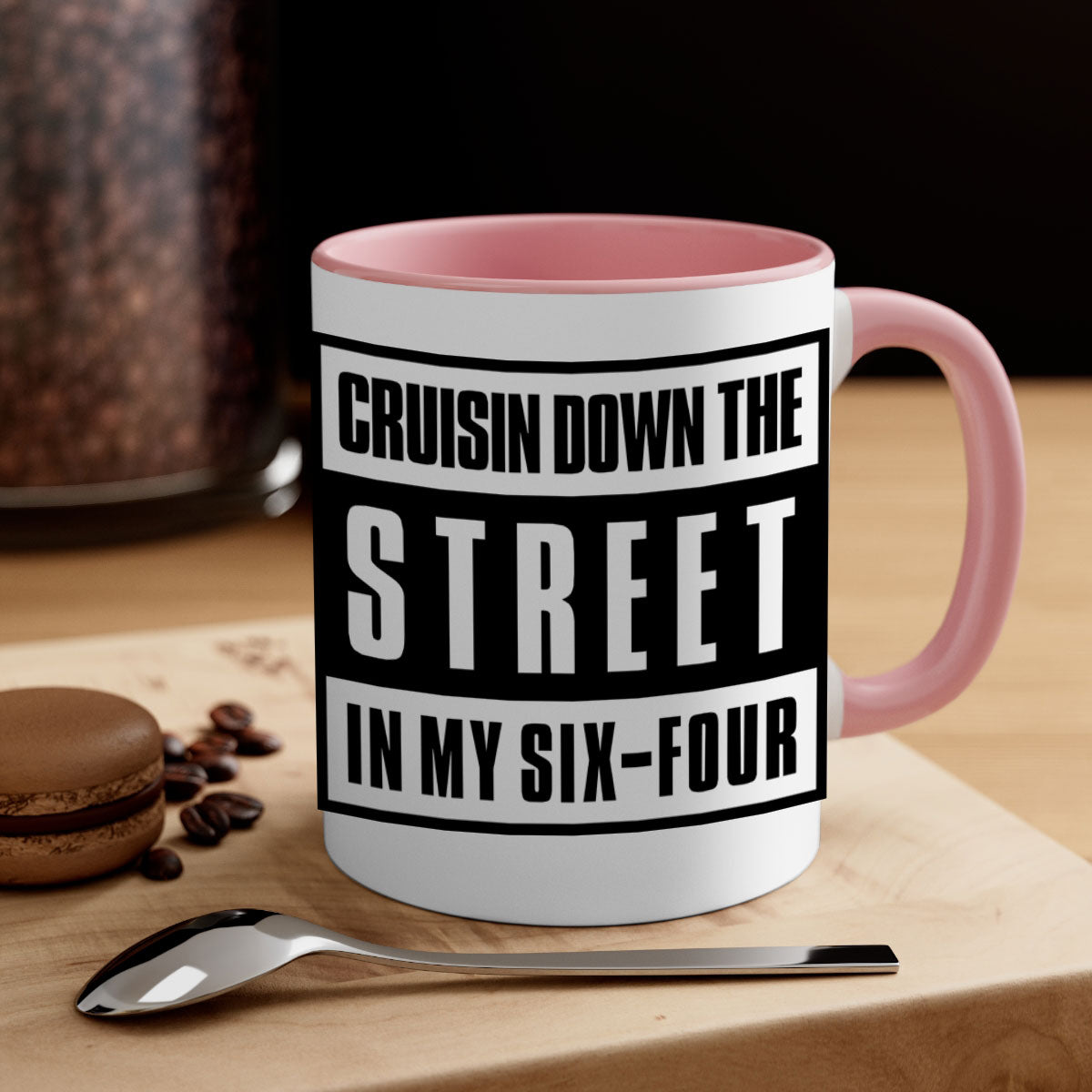A stylish black and colored two-tone ceramic mug with glossy finish, featuring the phrase 'cruisin down the street 181#'.
