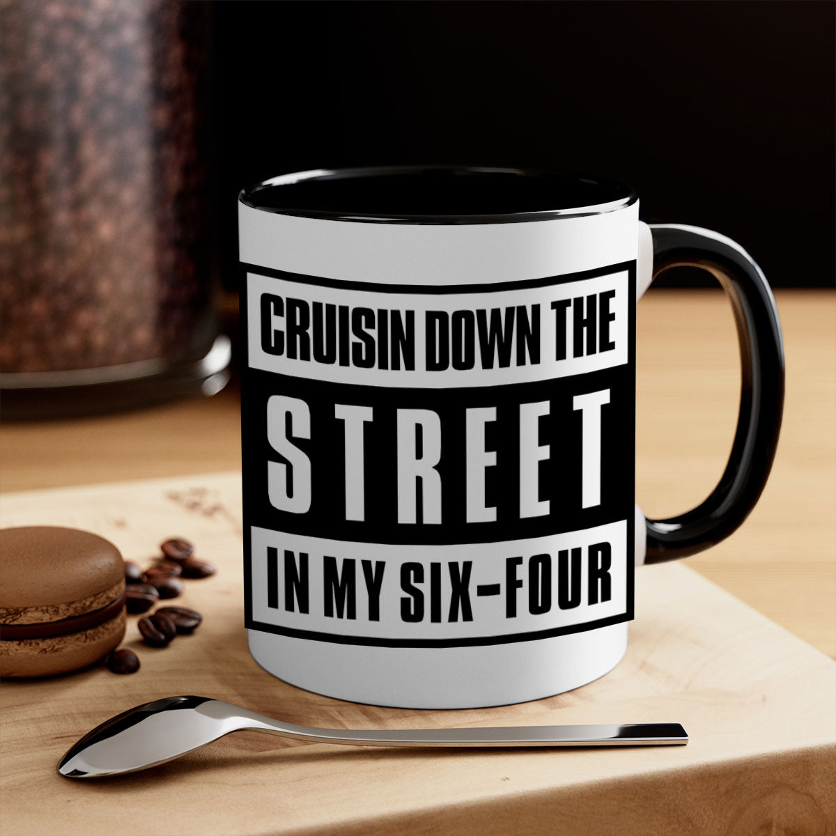 A stylish black and colored two-tone ceramic mug with glossy finish, featuring the phrase 'cruisin down the street 181#'.