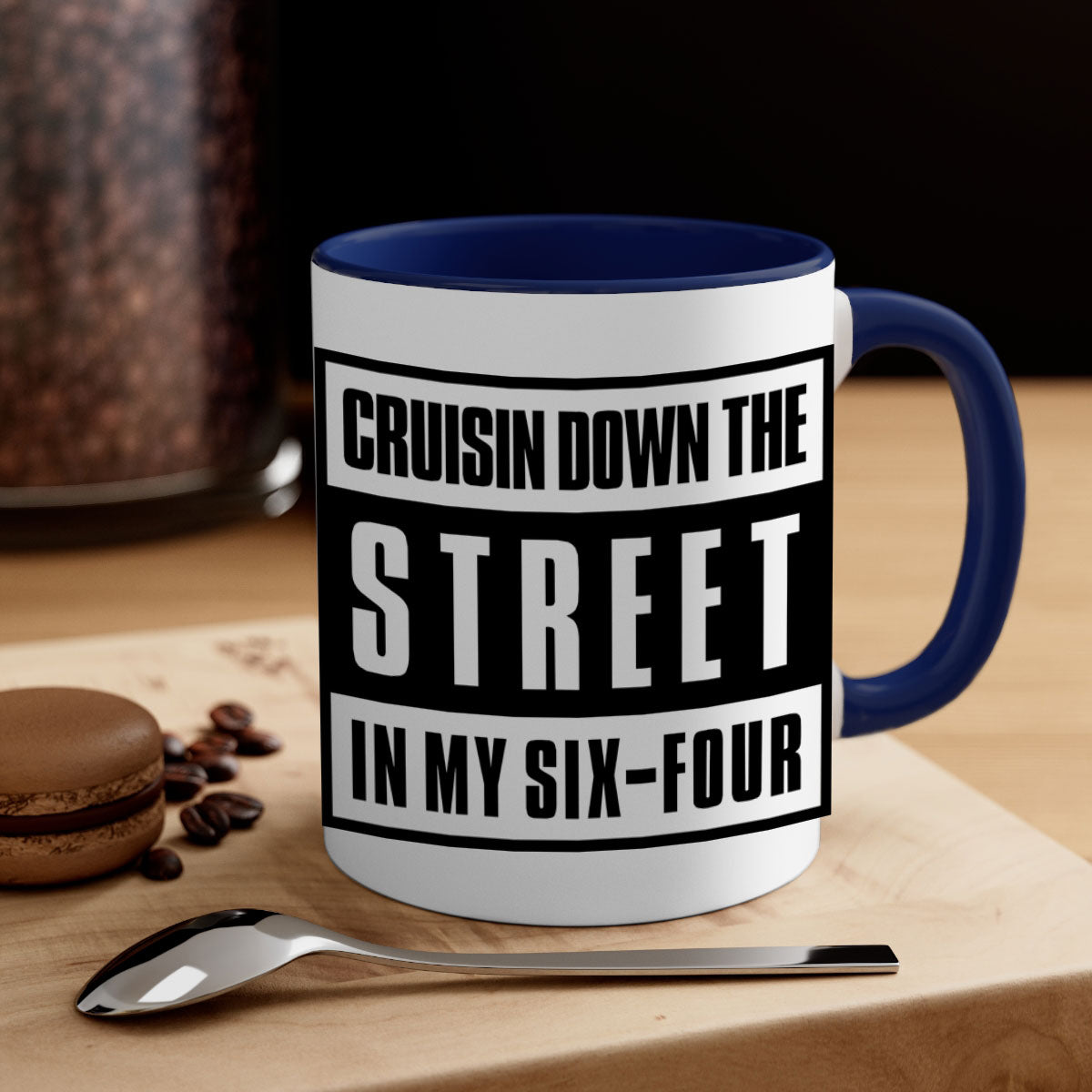 A stylish black and colored two-tone ceramic mug with glossy finish, featuring the phrase 'cruisin down the street 181#'.