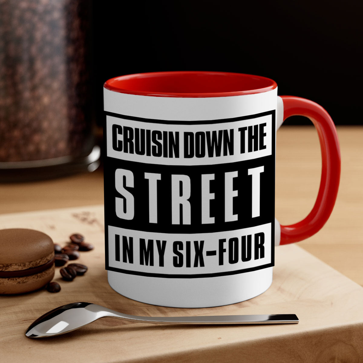 A stylish black and colored two-tone ceramic mug with glossy finish, featuring the phrase 'cruisin down the street 181#'.