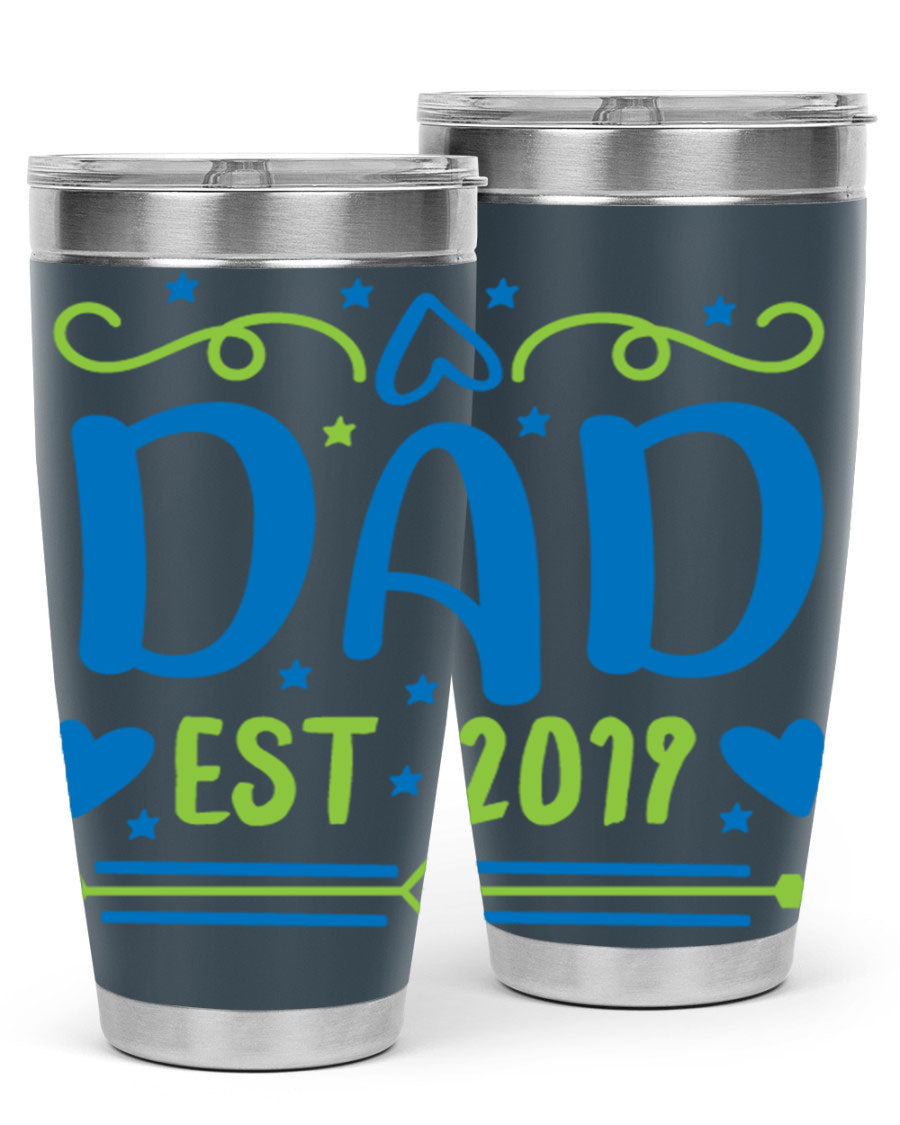 A stylish 'Dad est 99#' tumbler in stainless steel, showcasing its double wall vacuum design and drink-thru lid.