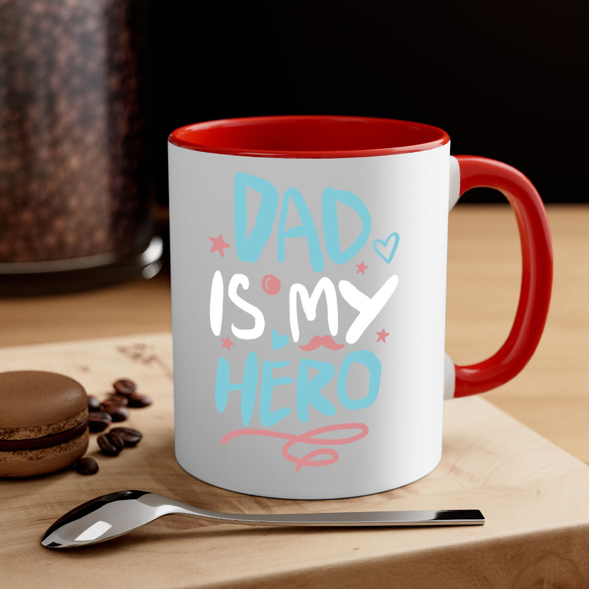 A two-tone 'Dad is My Hero' mug featuring a glossy finish, colored handle, and interior, available in five colors.
