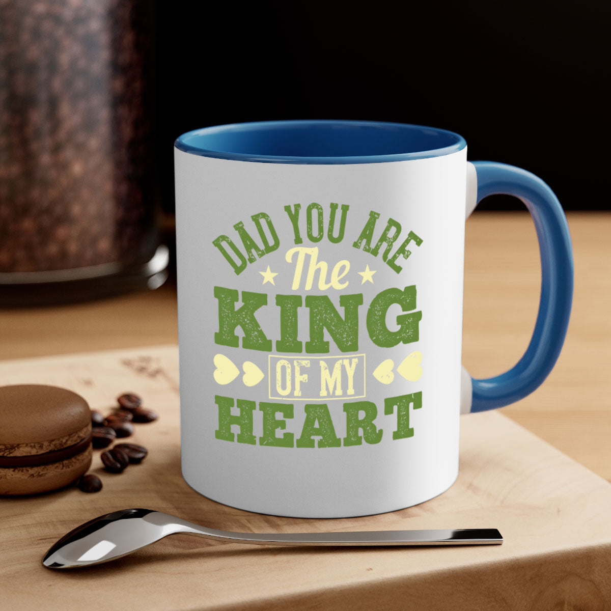 Ceramic coffee mug with a glossy finish, featuring the text 'Dad You Are the King of My Heart' and a colorful handle, available in multiple colors.