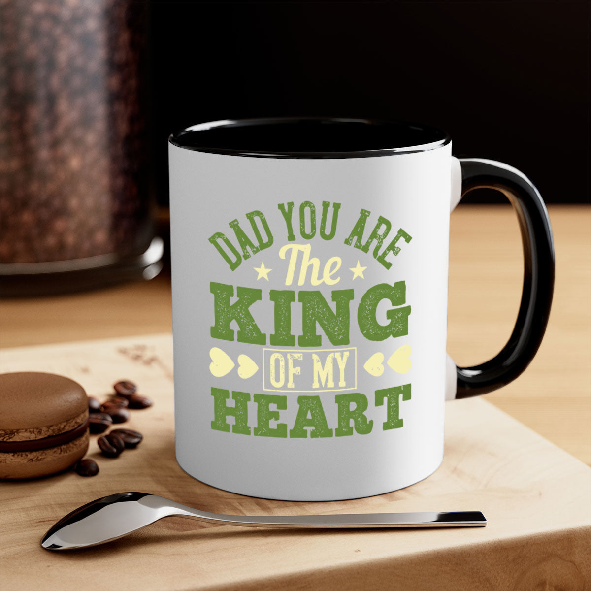 Ceramic coffee mug with a glossy finish, featuring the text 'Dad You Are the King of My Heart' and a colorful handle, available in multiple colors.