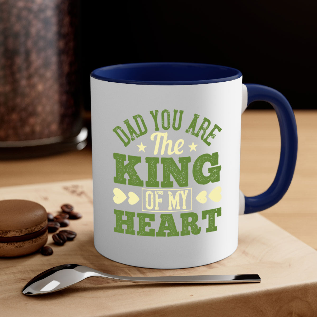 Ceramic coffee mug with a glossy finish, featuring the text 'Dad You Are the King of My Heart' and a colorful handle, available in multiple colors.