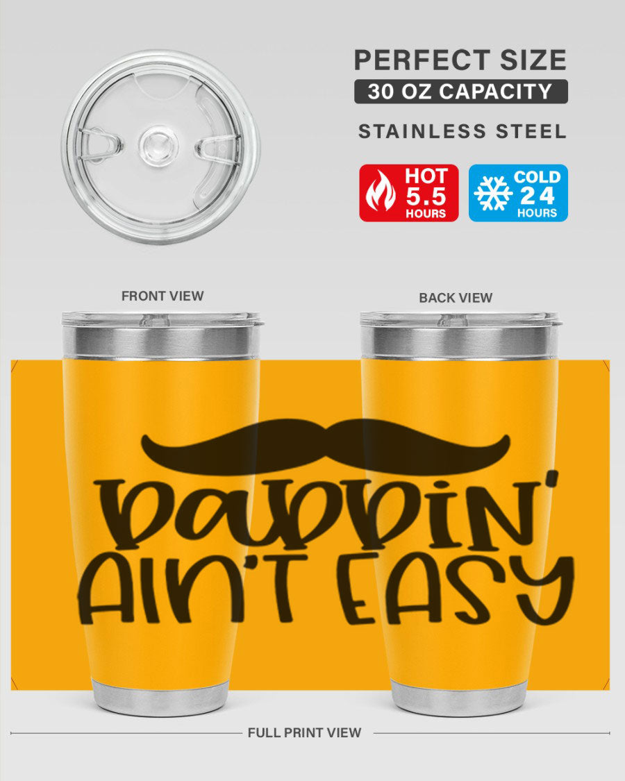 20oz stainless steel tumbler with 'Daddin Aint Easy' print, featuring a drink-thru lid and double wall vacuum insulation.