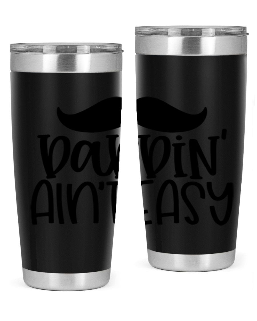 20oz stainless steel tumbler with 'Daddin Aint Easy' print, featuring a drink-thru lid and double wall vacuum insulation.