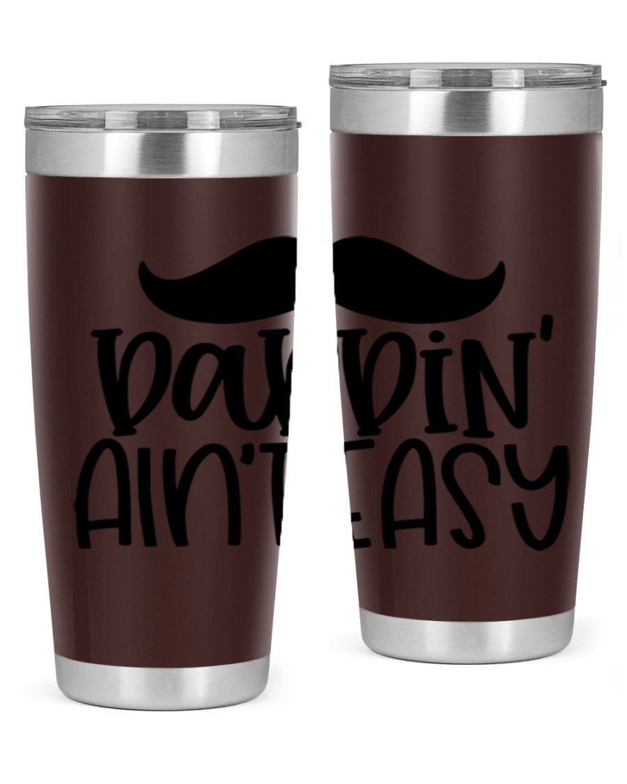 20oz stainless steel tumbler with 'Daddin Aint Easy' print, featuring a drink-thru lid and double wall vacuum insulation.