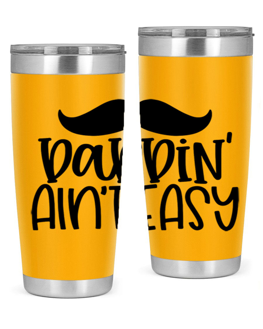 20oz stainless steel tumbler with 'Daddin Aint Easy' print, featuring a drink-thru lid and double wall vacuum insulation.