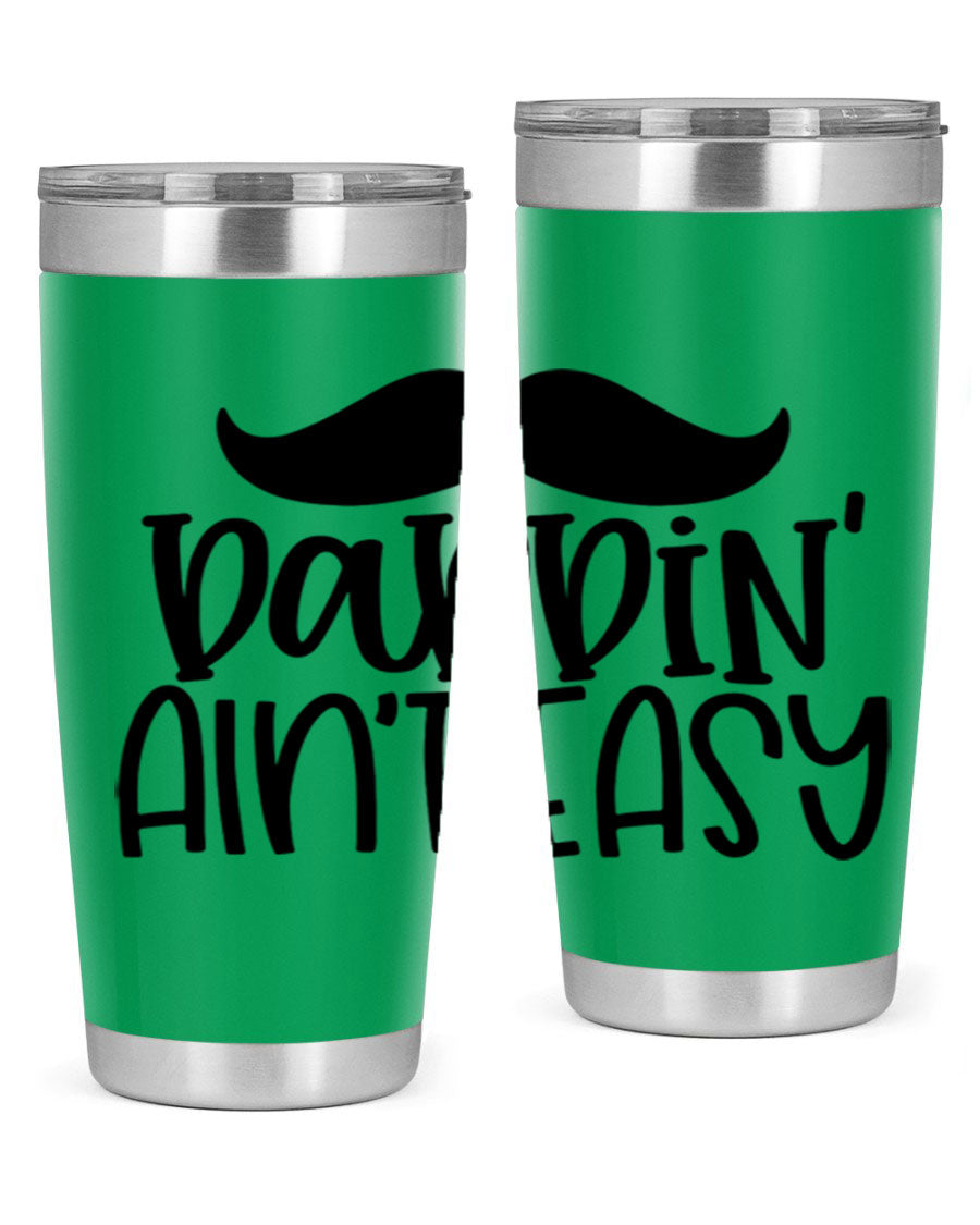 20oz stainless steel tumbler with 'Daddin Aint Easy' print, featuring a drink-thru lid and double wall vacuum insulation.