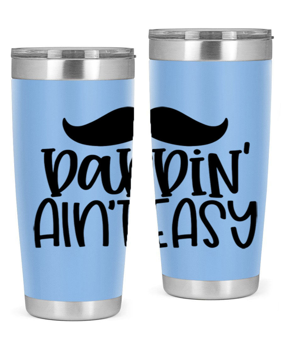 20oz stainless steel tumbler with 'Daddin Aint Easy' print, featuring a drink-thru lid and double wall vacuum insulation.
