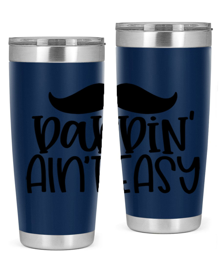 20oz stainless steel tumbler with 'Daddin Aint Easy' print, featuring a drink-thru lid and double wall vacuum insulation.