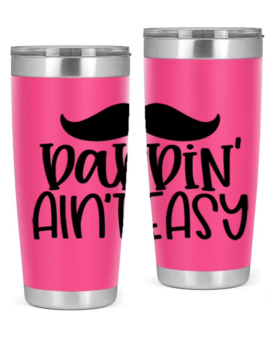 20oz stainless steel tumbler with 'Daddin Aint Easy' print, featuring a drink-thru lid and double wall vacuum insulation.