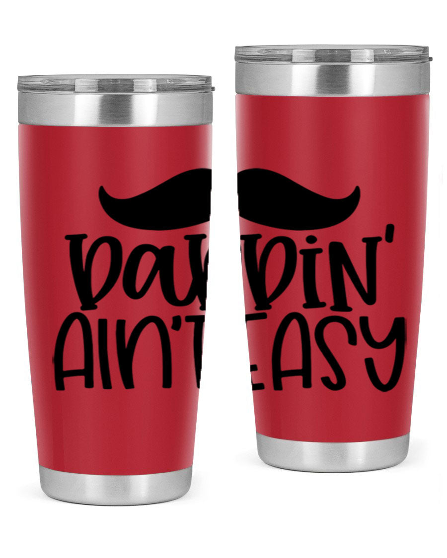 20oz stainless steel tumbler with 'Daddin Aint Easy' print, featuring a drink-thru lid and double wall vacuum insulation.