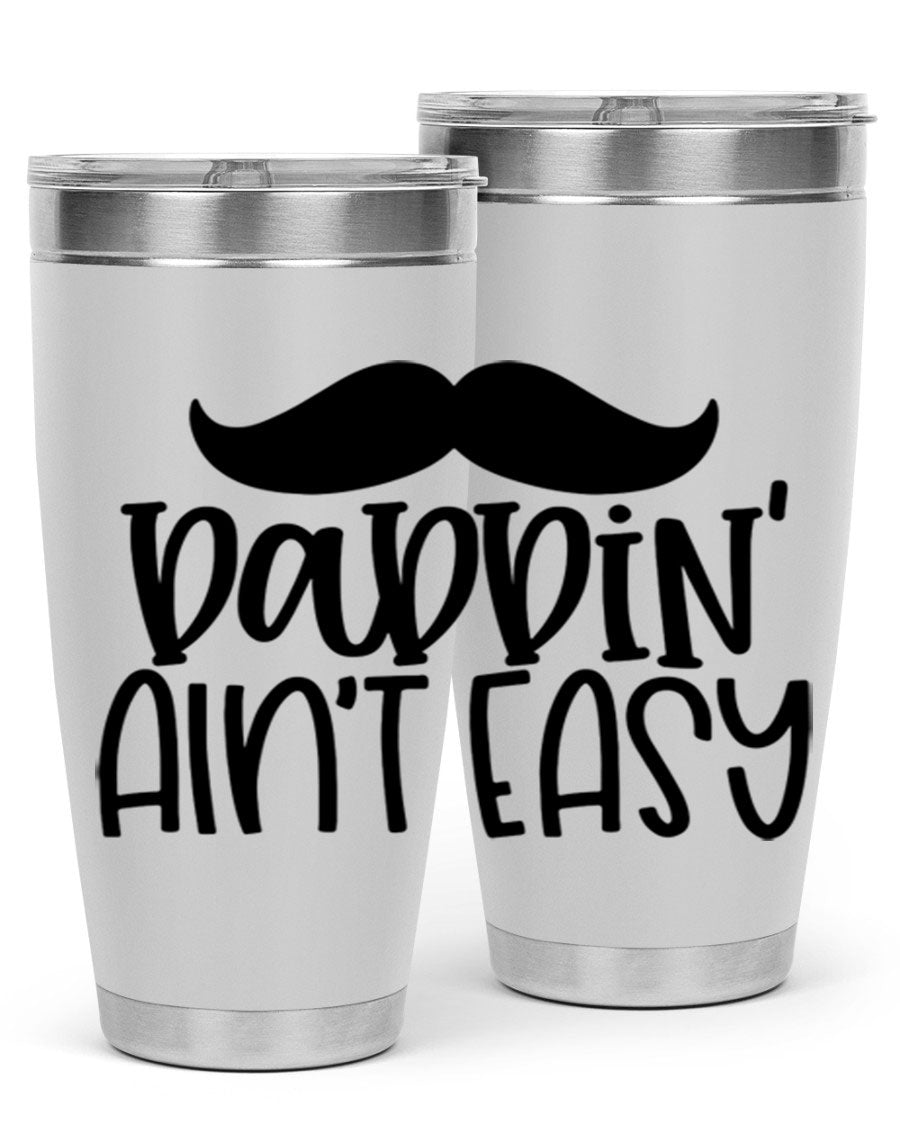 20oz stainless steel tumbler with 'Daddin Aint Easy' print, featuring a drink-thru lid and double wall vacuum insulation.