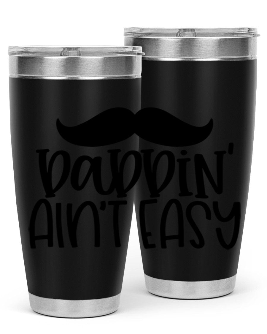 20oz stainless steel tumbler with 'Daddin Aint Easy' print, featuring a drink-thru lid and double wall vacuum insulation.