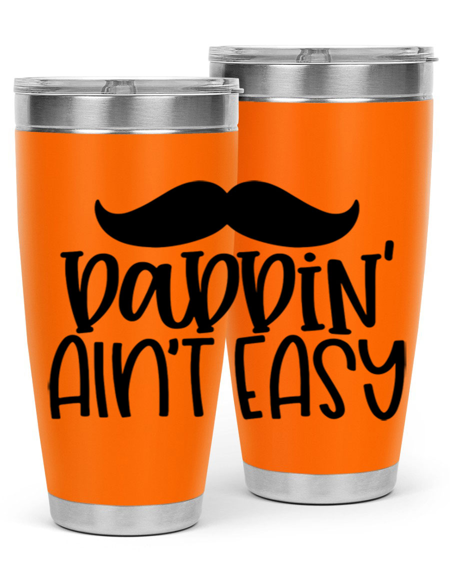 20oz stainless steel tumbler with 'Daddin Aint Easy' print, featuring a drink-thru lid and double wall vacuum insulation.