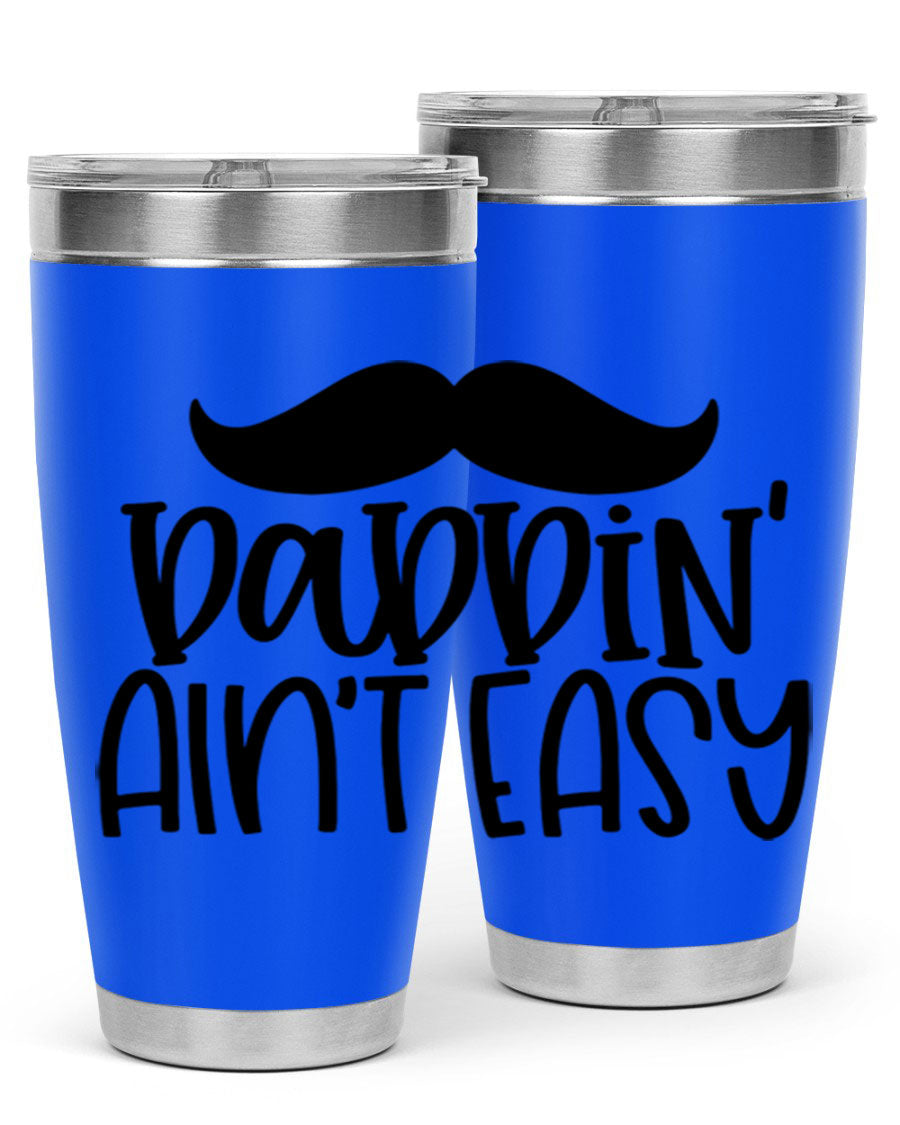 20oz stainless steel tumbler with 'Daddin Aint Easy' print, featuring a drink-thru lid and double wall vacuum insulation.