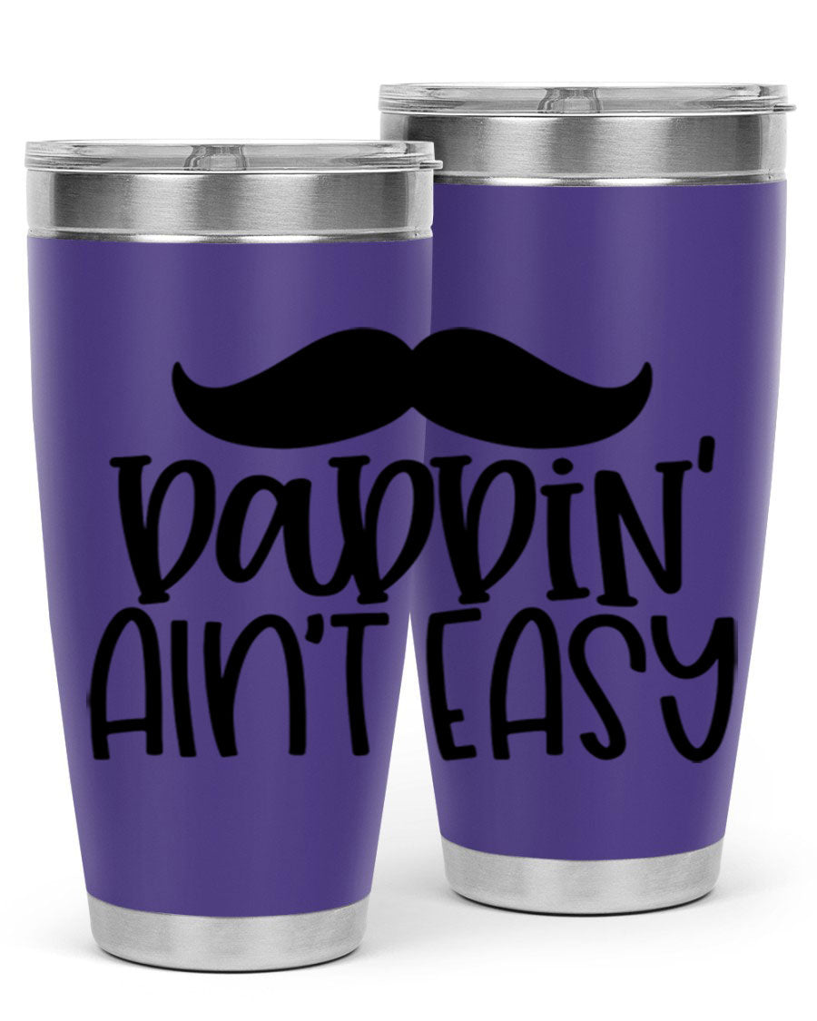 20oz stainless steel tumbler with 'Daddin Aint Easy' print, featuring a drink-thru lid and double wall vacuum insulation.