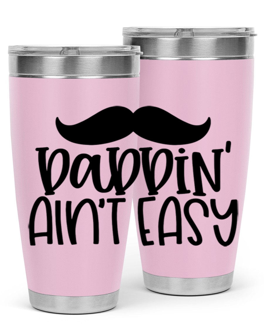 20oz stainless steel tumbler with 'Daddin Aint Easy' print, featuring a drink-thru lid and double wall vacuum insulation.