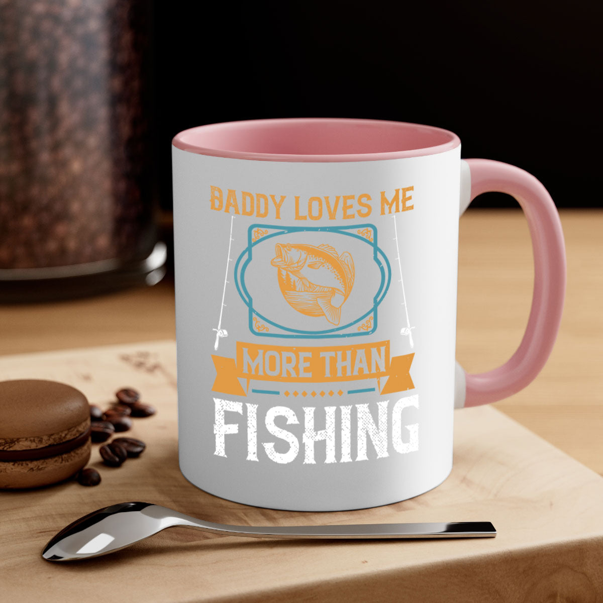 Ceramic coffee mug with 'Daddy Loves Me More Than Fishing' design, featuring a glossy finish and colorful handle.