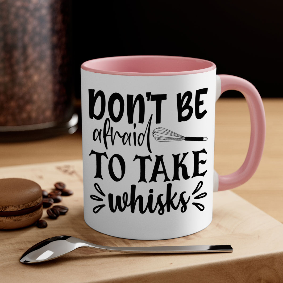 A stylish two-tone ceramic coffee mug with a colored handle and interior, featuring the phrase 'Don't Be Afraid to Take Whisks'.