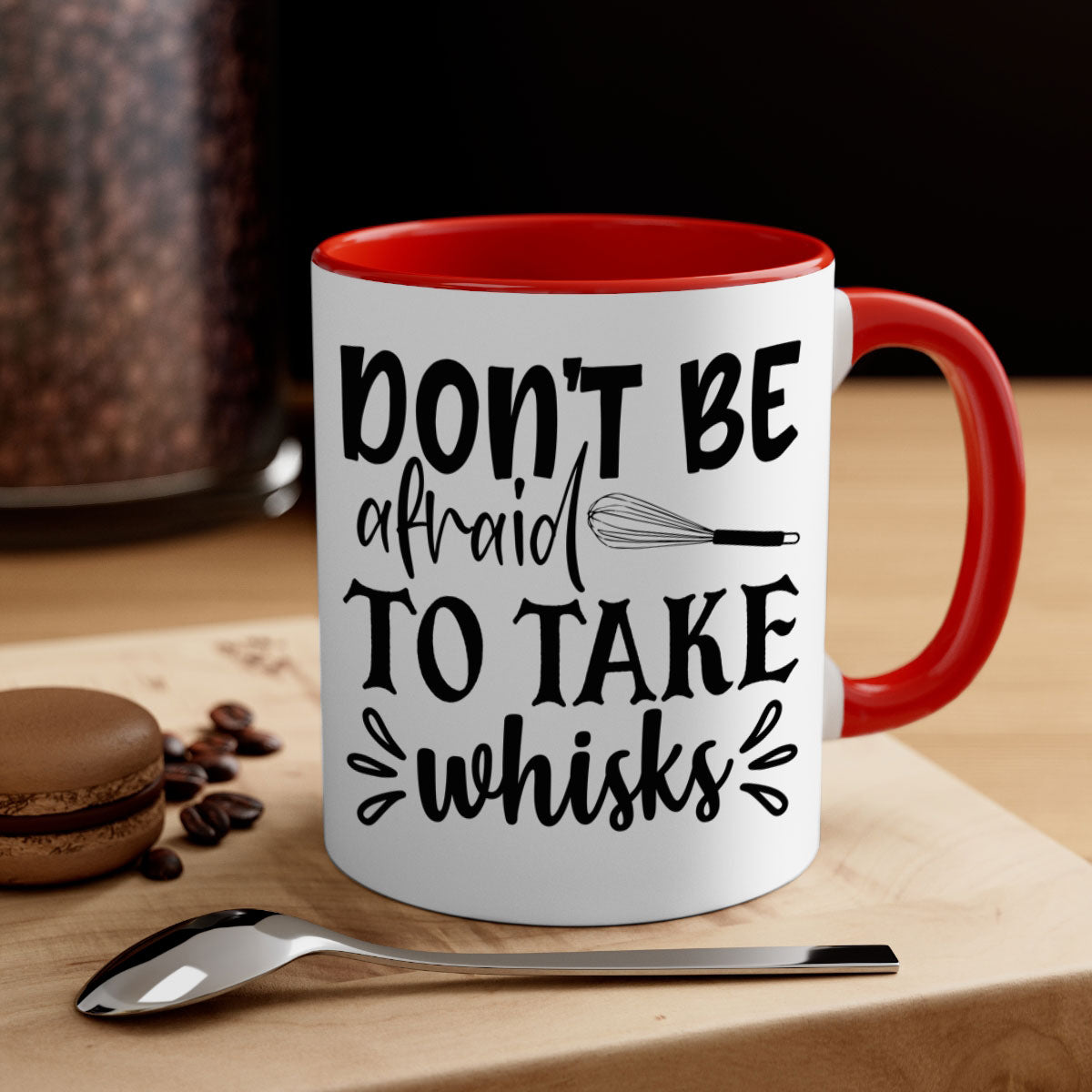 A stylish two-tone ceramic coffee mug with a colored handle and interior, featuring the phrase 'Don't Be Afraid to Take Whisks'.