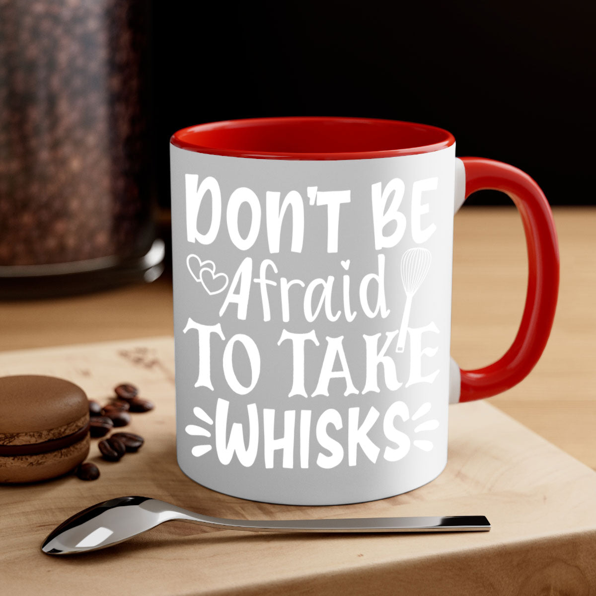 A stylish two-tone ceramic coffee mug with a colored handle and interior, featuring the phrase 'Don't Be Afraid to Take Whisks'.