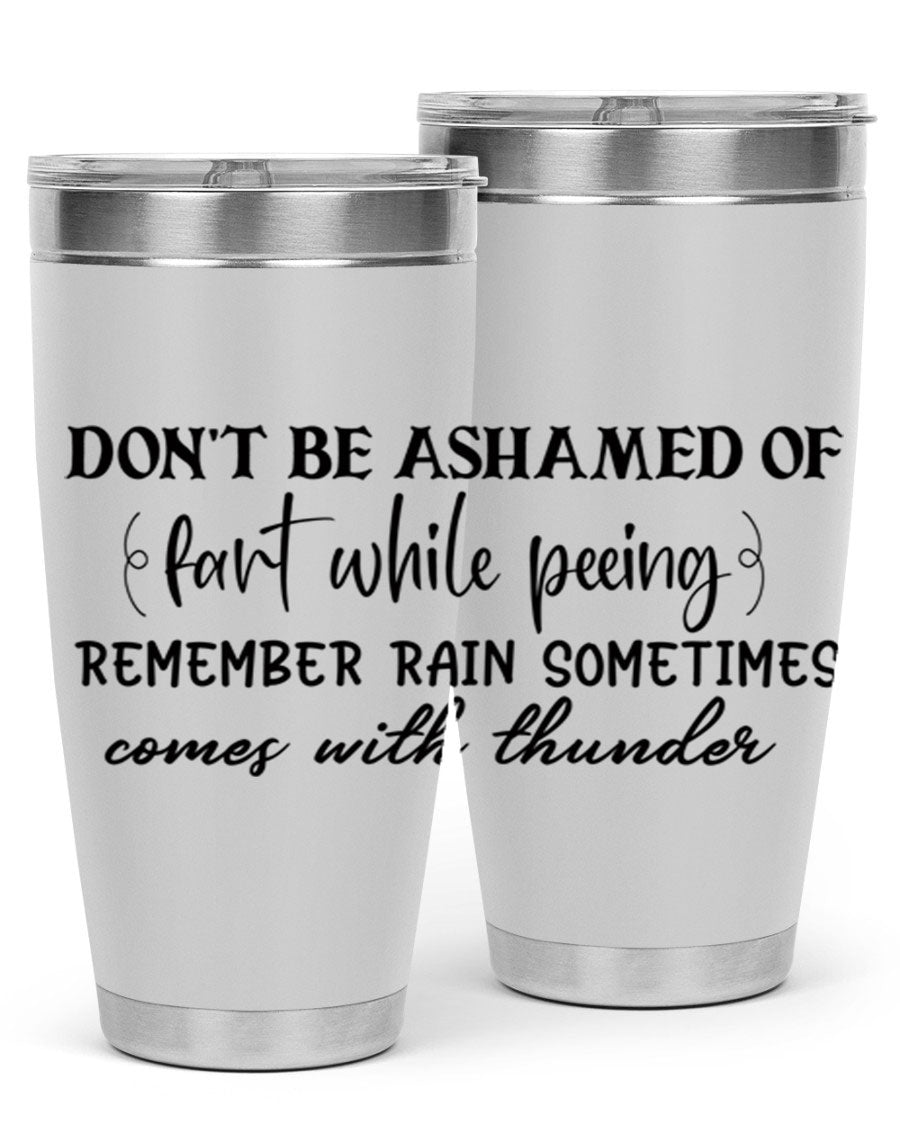 A humorous stainless steel tumbler with the phrase 'Don't be ashamed of fart while peeing, remember rain sometimes comes' printed on it, showcasing its sleek design.