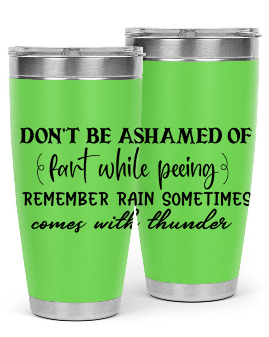 A humorous stainless steel tumbler with the phrase 'Don't be ashamed of fart while peeing, remember rain sometimes comes' printed on it, showcasing its sleek design.