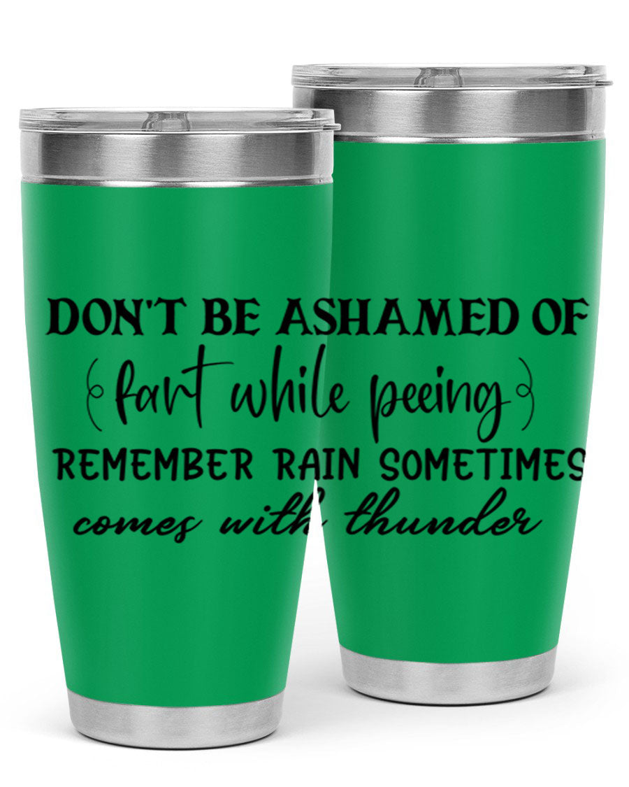 A humorous stainless steel tumbler with the phrase 'Don't be ashamed of fart while peeing, remember rain sometimes comes' printed on it, showcasing its sleek design.