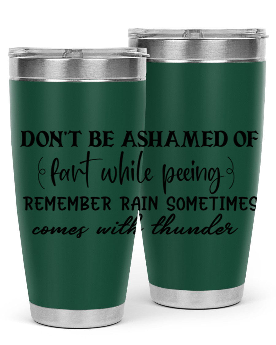 A humorous stainless steel tumbler with the phrase 'Don't be ashamed of fart while peeing, remember rain sometimes comes' printed on it, showcasing its sleek design.
