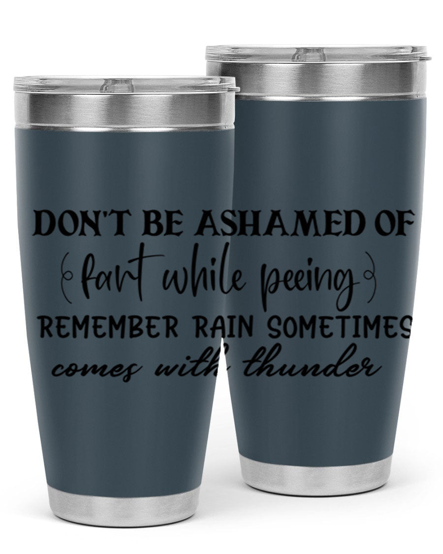 A humorous stainless steel tumbler with the phrase 'Don't be ashamed of fart while peeing, remember rain sometimes comes' printed on it, showcasing its sleek design.