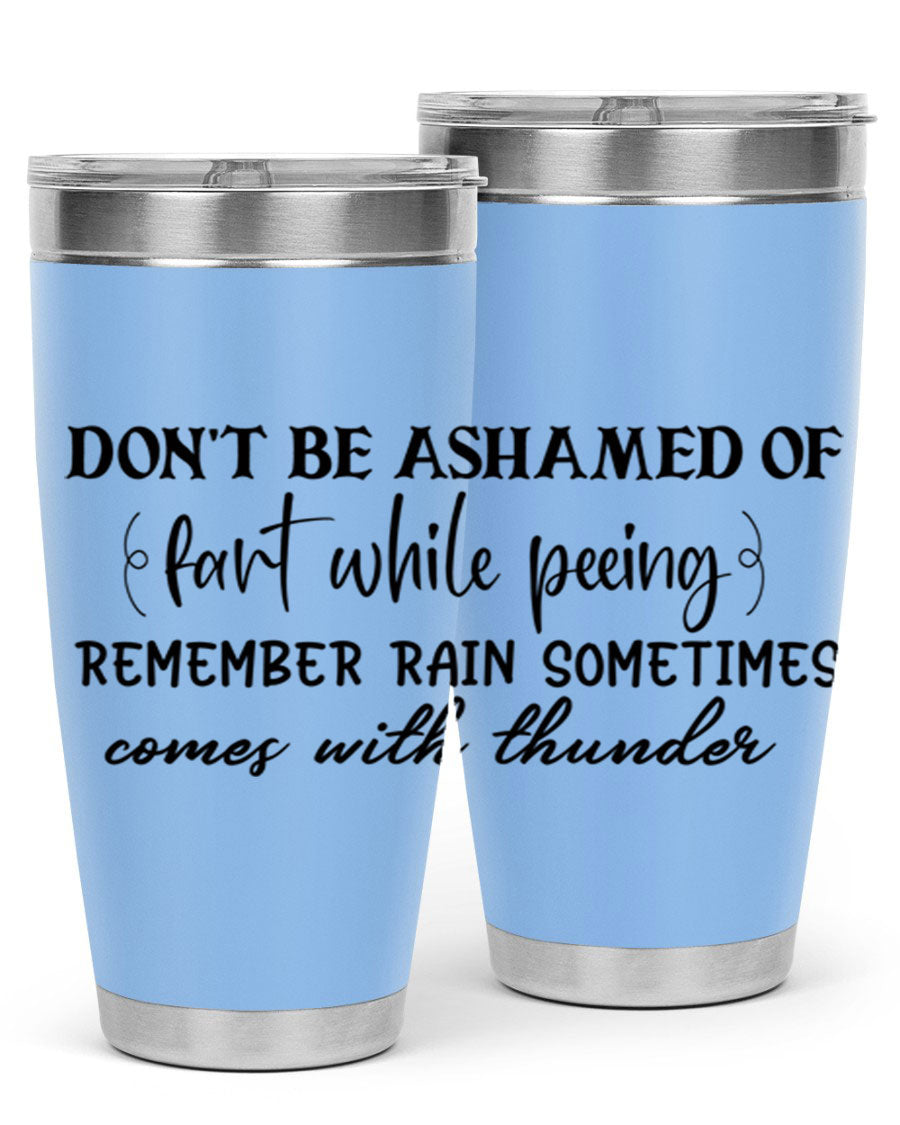 A humorous stainless steel tumbler with the phrase 'Don't be ashamed of fart while peeing, remember rain sometimes comes' printed on it, showcasing its sleek design.
