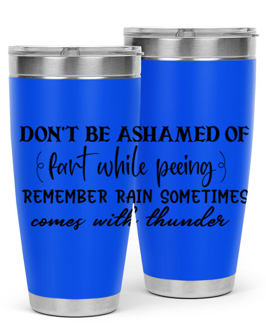 A humorous stainless steel tumbler with the phrase 'Don't be ashamed of fart while peeing, remember rain sometimes comes' printed on it, showcasing its sleek design.