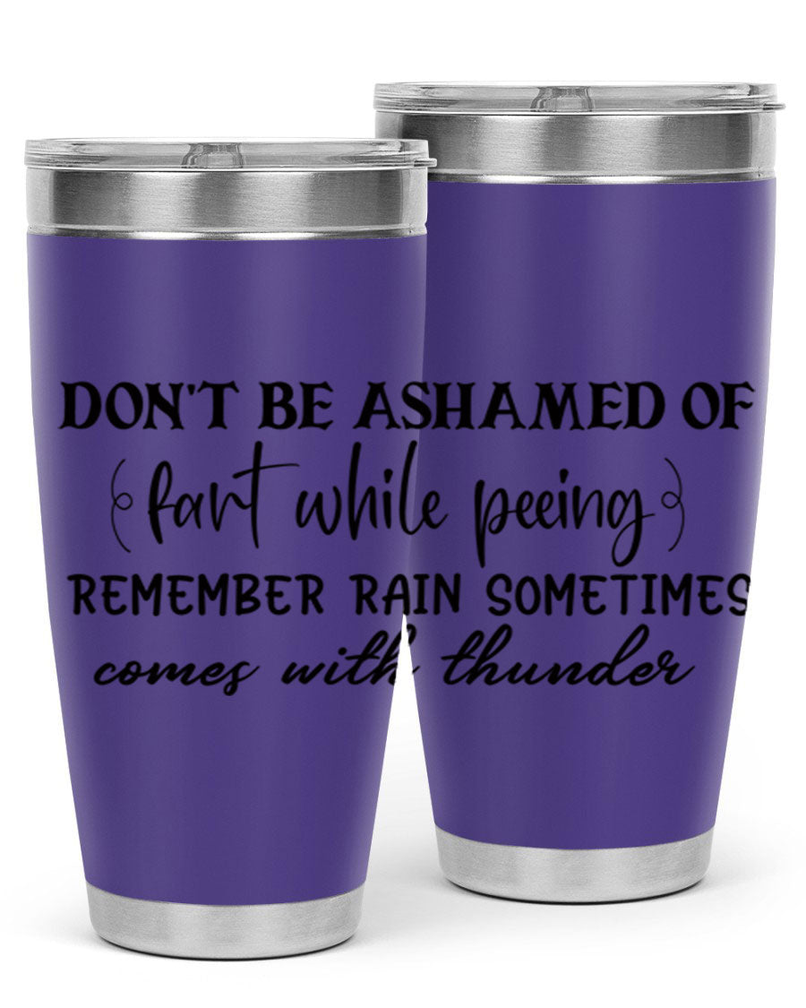 A humorous stainless steel tumbler with the phrase 'Don't be ashamed of fart while peeing, remember rain sometimes comes' printed on it, showcasing its sleek design.