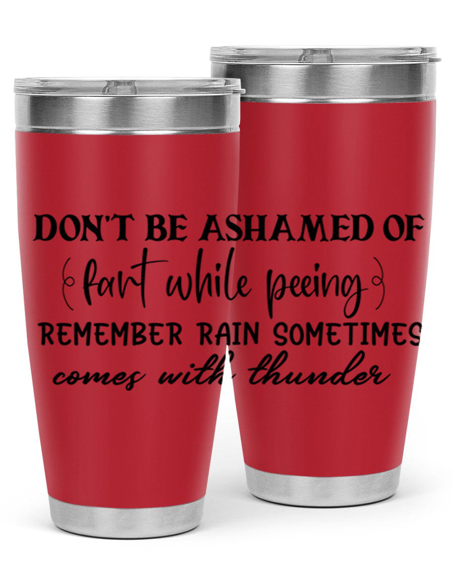 A humorous stainless steel tumbler with the phrase 'Don't be ashamed of fart while peeing, remember rain sometimes comes' printed on it, showcasing its sleek design.