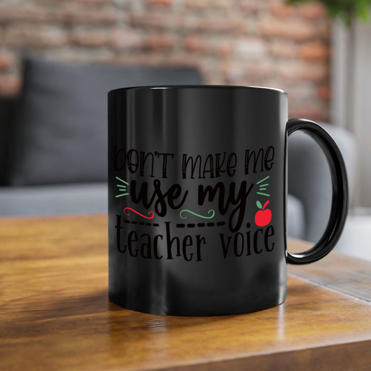 A stylish two-tone ceramic coffee mug with a colored handle and interior, featuring the phrase 'Don't Make Me Use My Teacher Voice' in a fun font.