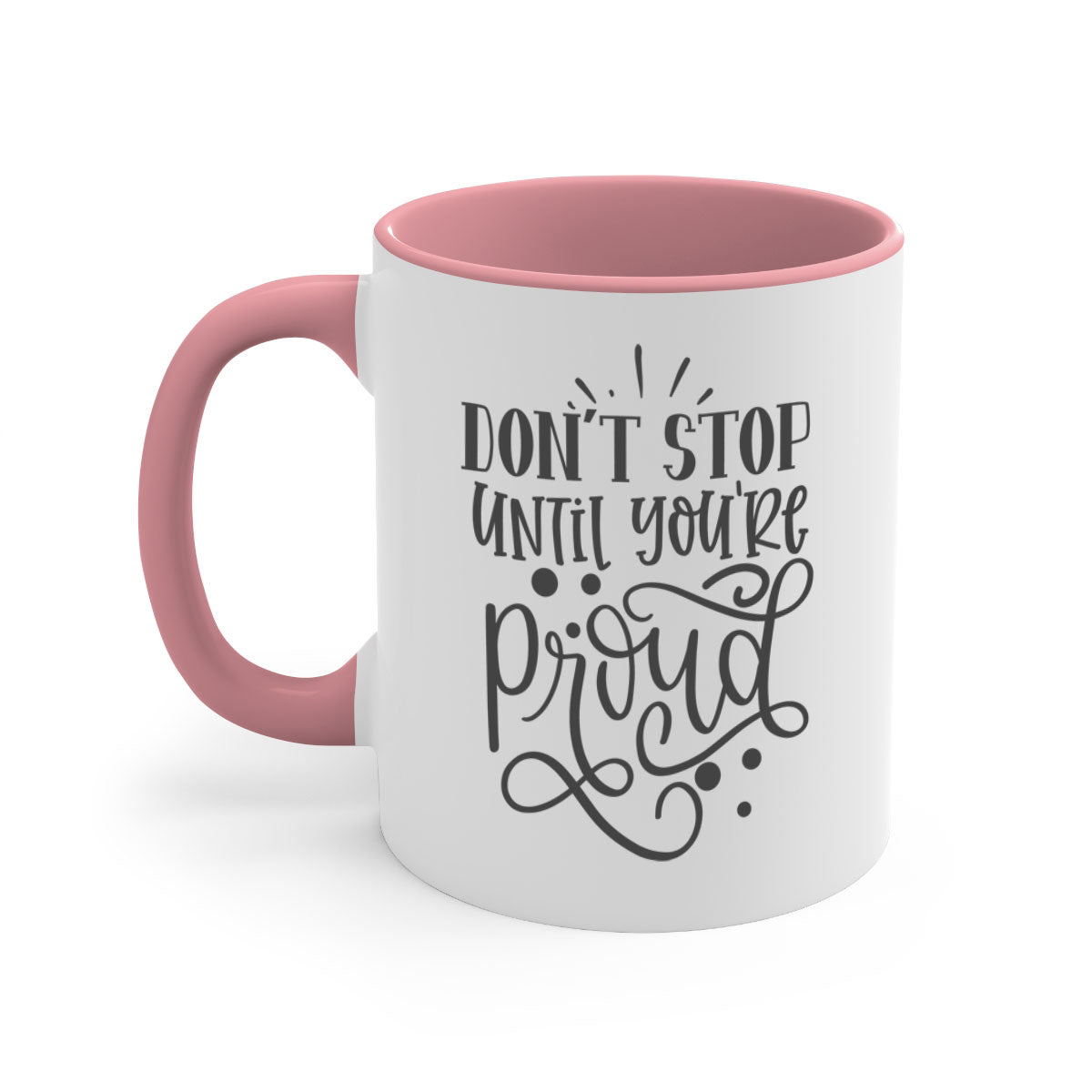 A stylish two-tone ceramic mug with a motivational quote 'Don't Stop Until You're Proud', featuring a colored handle and glossy finish.