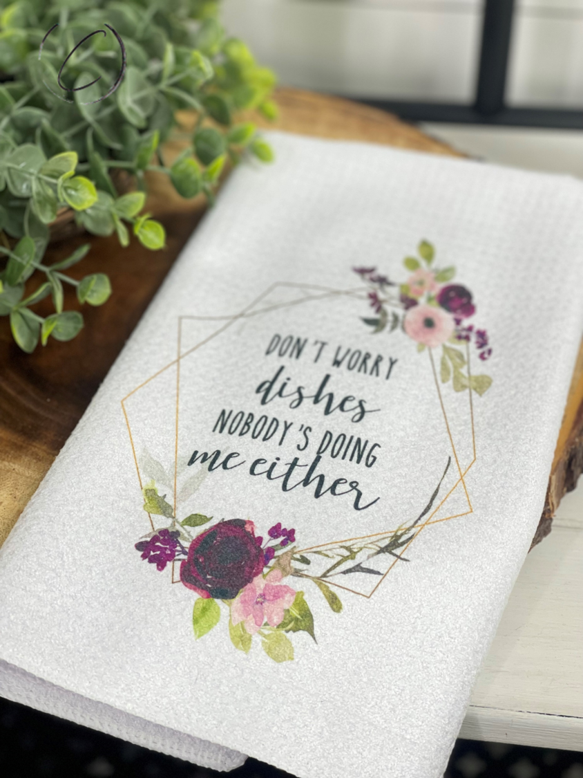 Don't Worry Dishes Waffle Weave Tea Towel featuring a stylish design and waffle pocket pattern for effective drying.