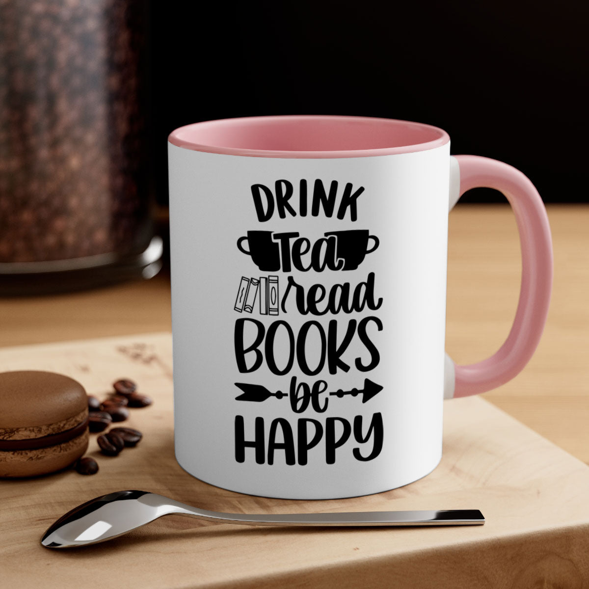 A stylish two-tone ceramic mug with a colored handle and interior, featuring the phrase 'drink tea read books be happy'.