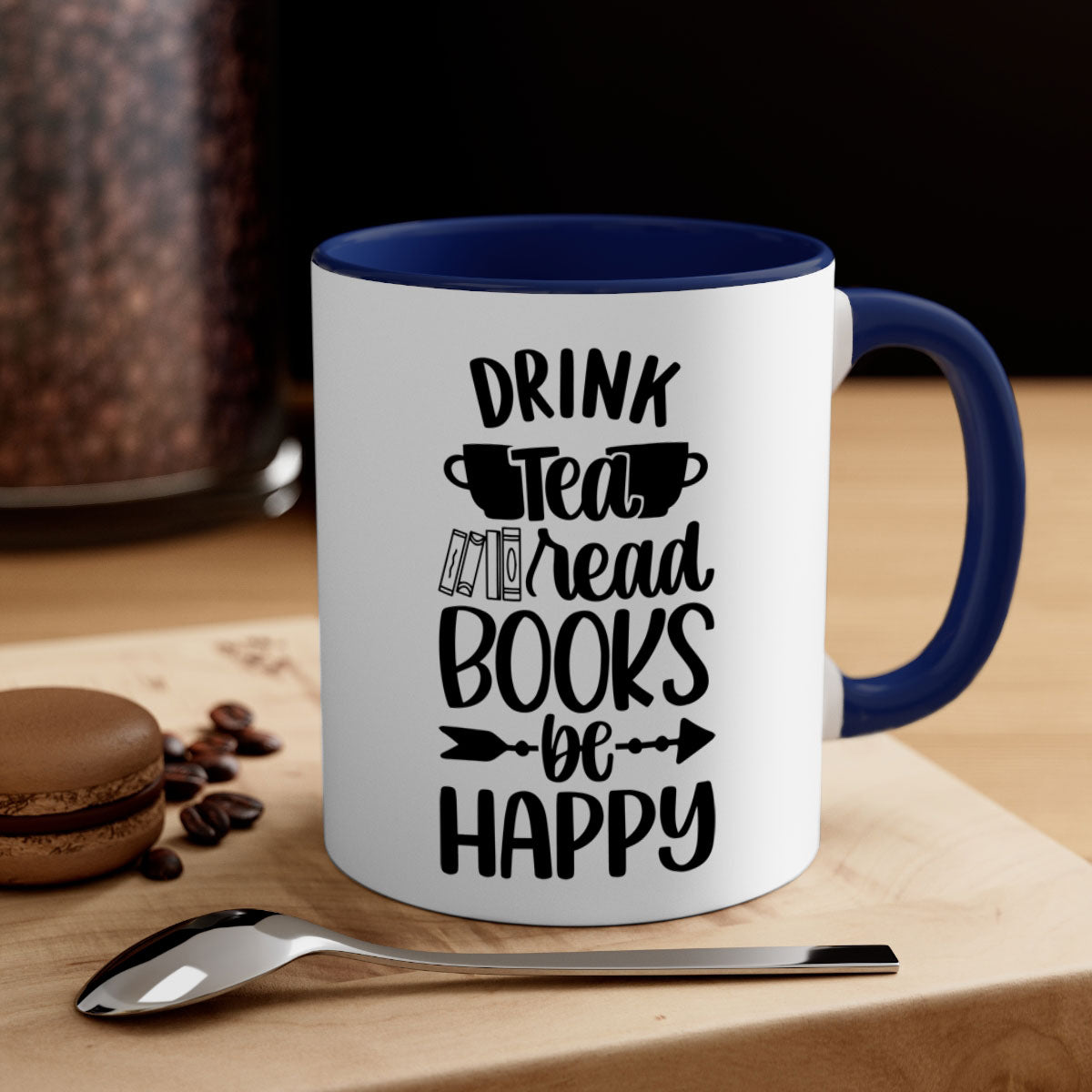 A stylish two-tone ceramic mug with a colored handle and interior, featuring the phrase 'drink tea read books be happy'.