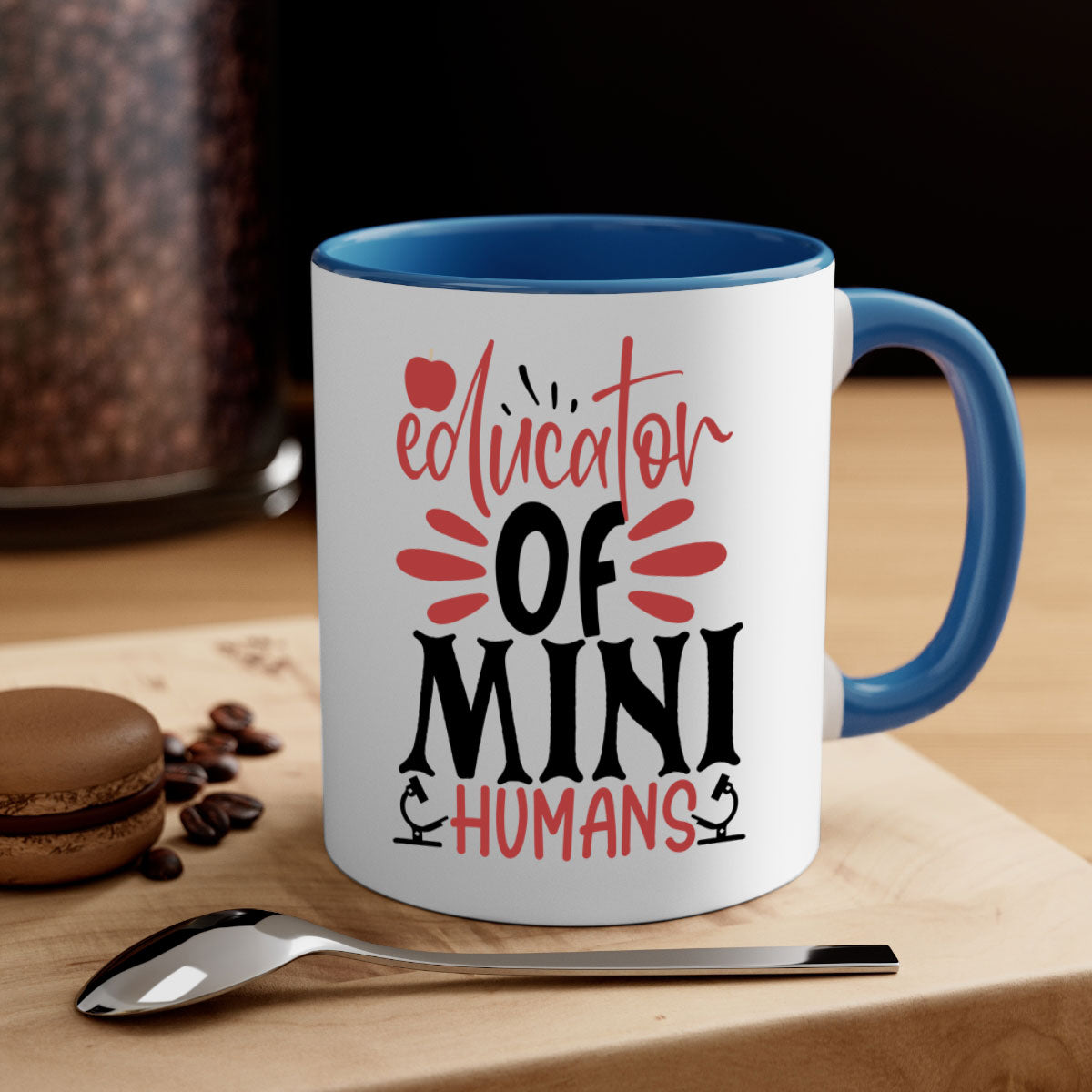 A stylish educator of mini humans mug with a glossy finish, featuring a colored handle and interior, available in five vibrant colors.